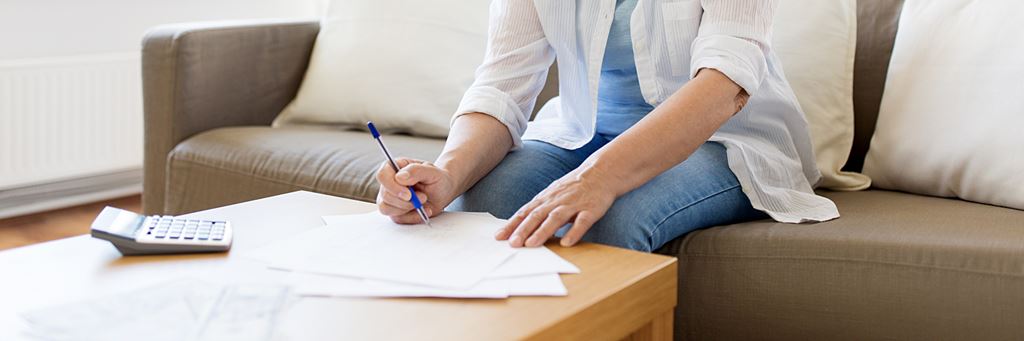 A person fills out an application for fixed index annuities.
