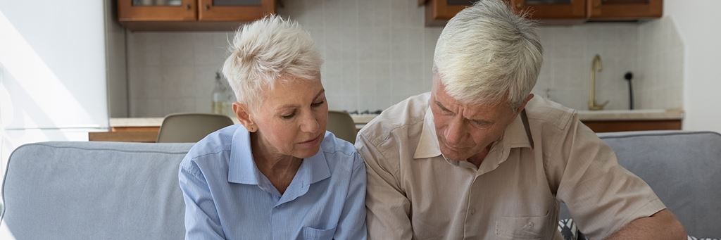 A couple reviewing their life insurance policies.