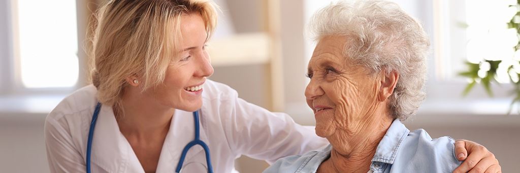 Doctor visiting senior woman.