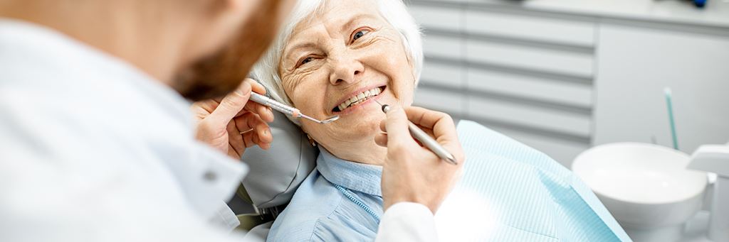 A woman gets a dental exam.