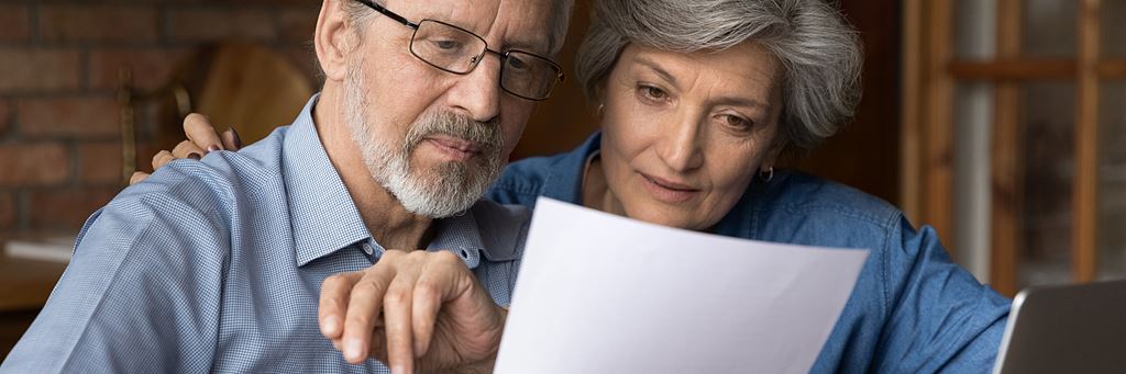 A couple looking over a document.