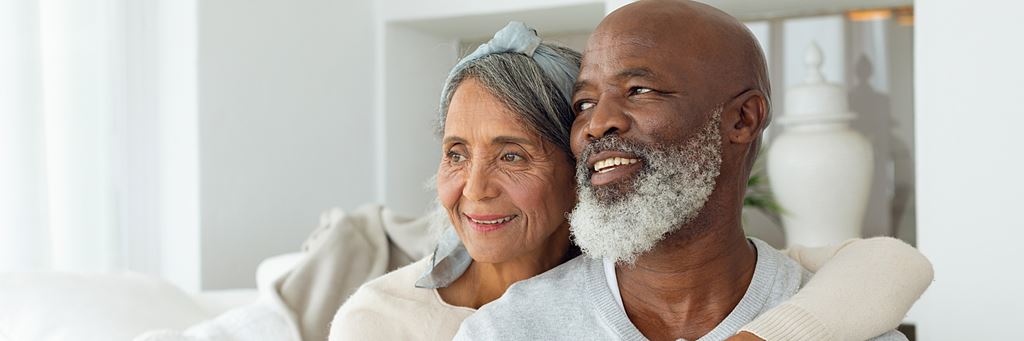 A senior couple hugging.