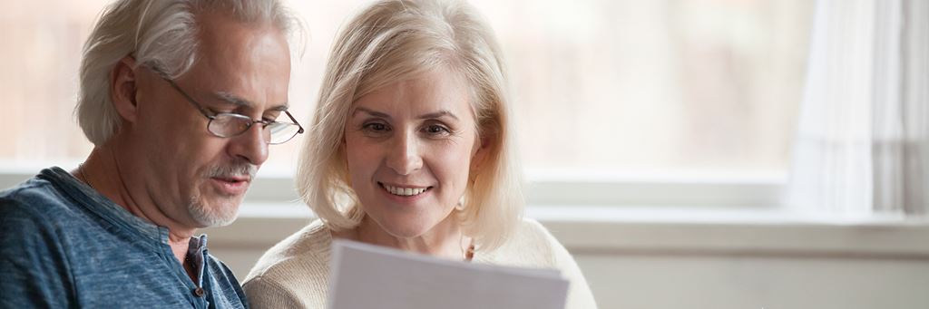 A couple reviews their life insurance policies