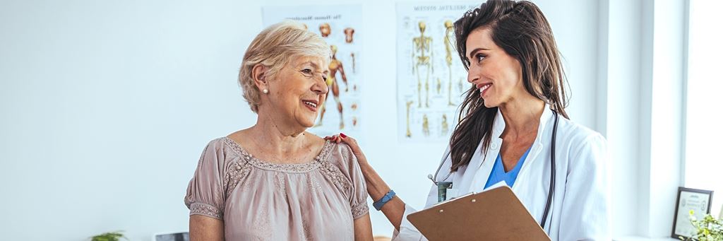 A woman meets with a doctor.