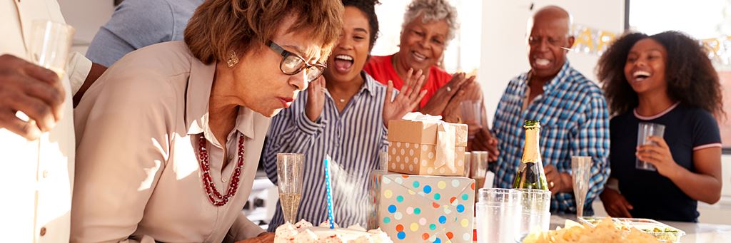 A woman celebrates her birthday with friends and family.