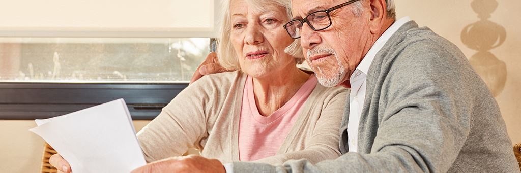 A couple reviews their Social Security statement to prepare for taxes.