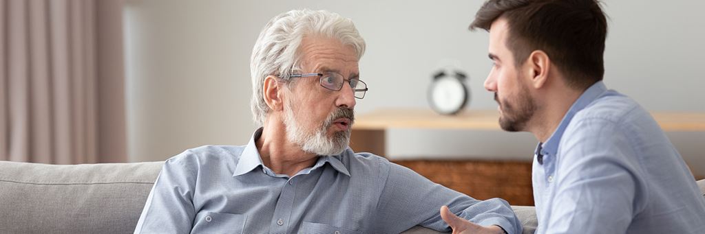 Father and son discussing an end-of-life care plan.