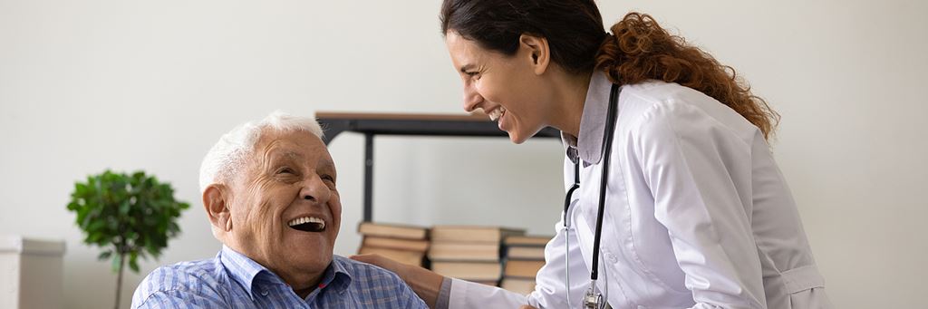 A smiling doctor and a patient.