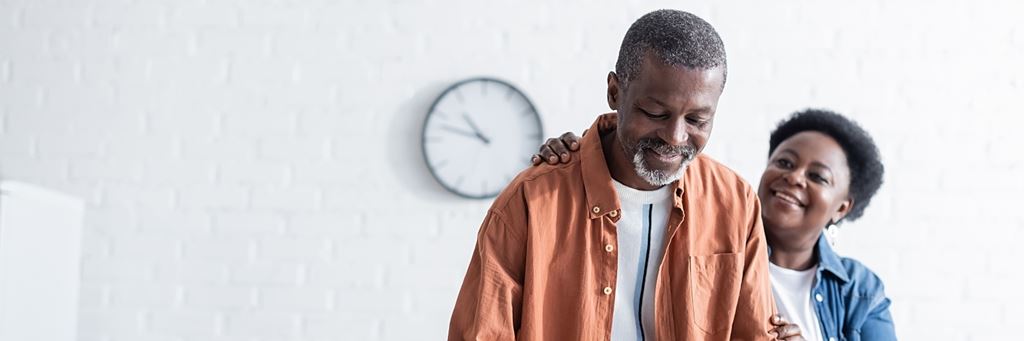 A smiling retired couple.
