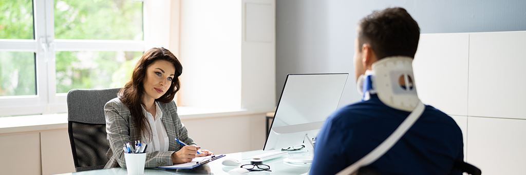 An insurance agent helps a person qualify for Social Security disability insurance.