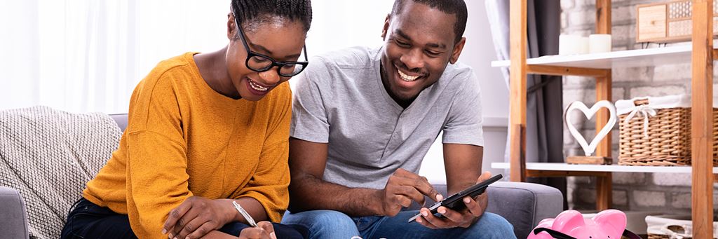 A happy couple plans their savings by following smart retirement strategies.